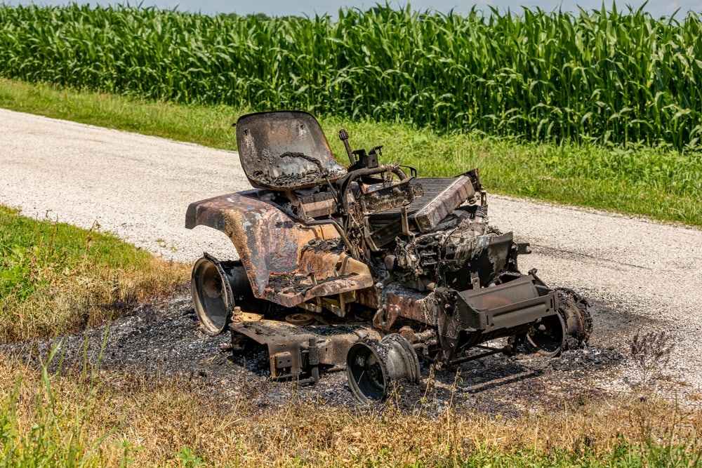 a lawn mower tractor damaged from fire