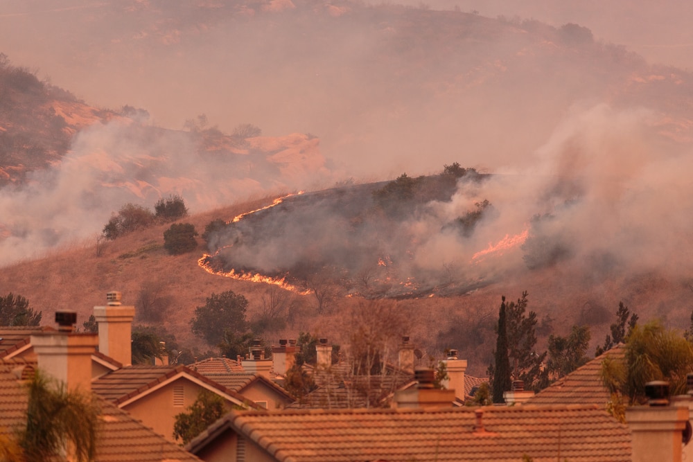 wildfire starting near houses in Anaheim Hills