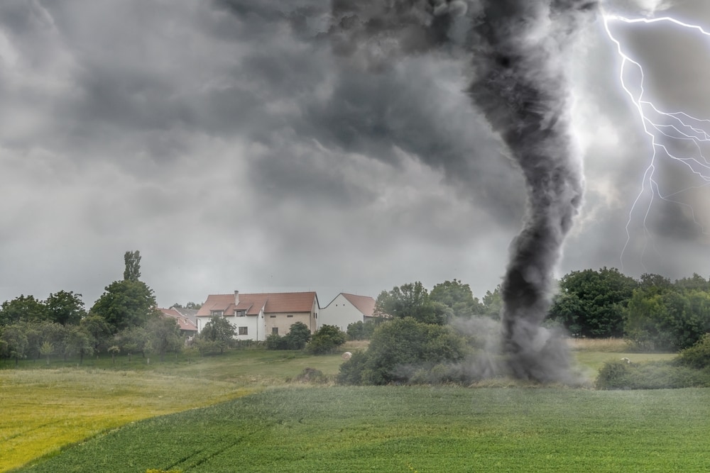 Tornado destroying the field of a house