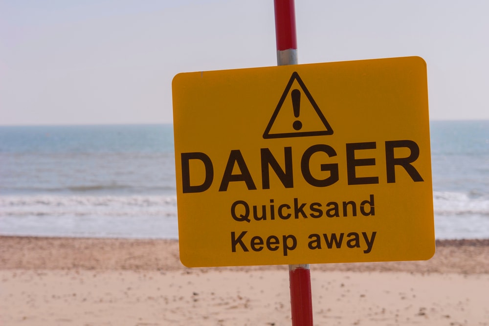 Warning quicksand danger sign