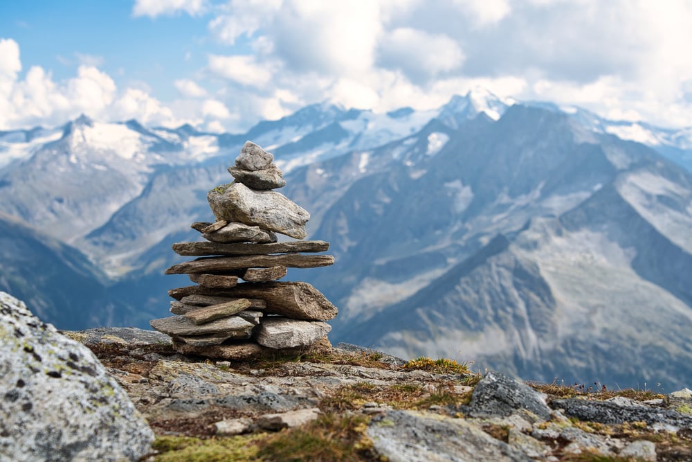 A pile of stones  or also called cairn in the Austrian alps and used as a hiking marker