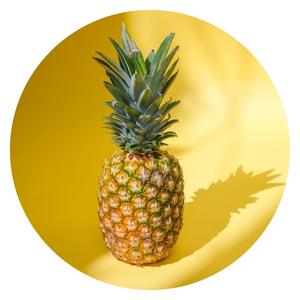 A pineapple on a a yellow background