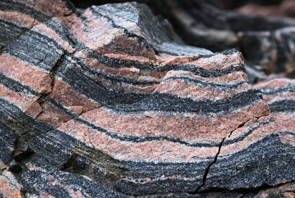 Foliated metamorphic rock that contains red veins