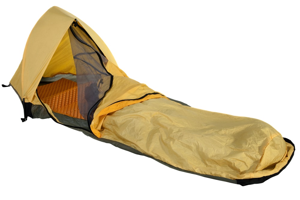 A yellow bivy sack with mosquito net