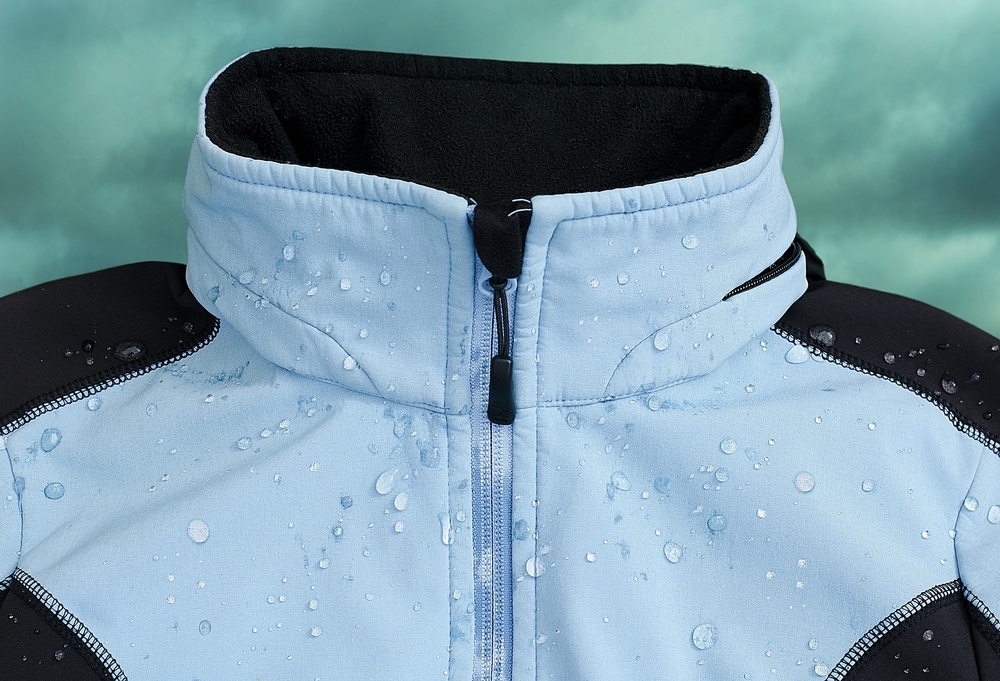 blue soft shell jacket with water droplets