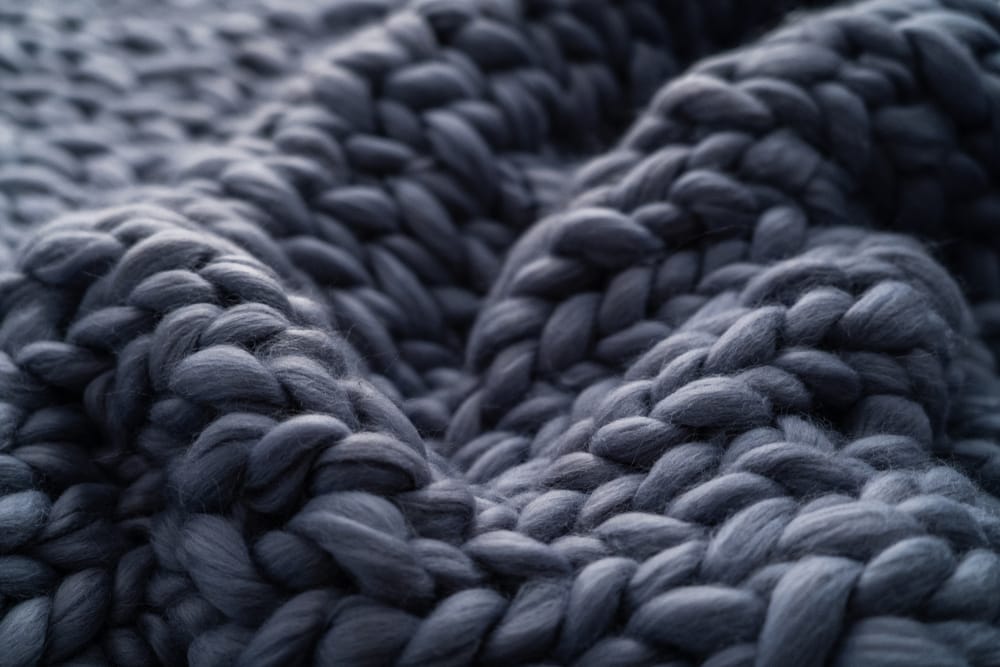 close up of a knitted blanket made of  merino wool 