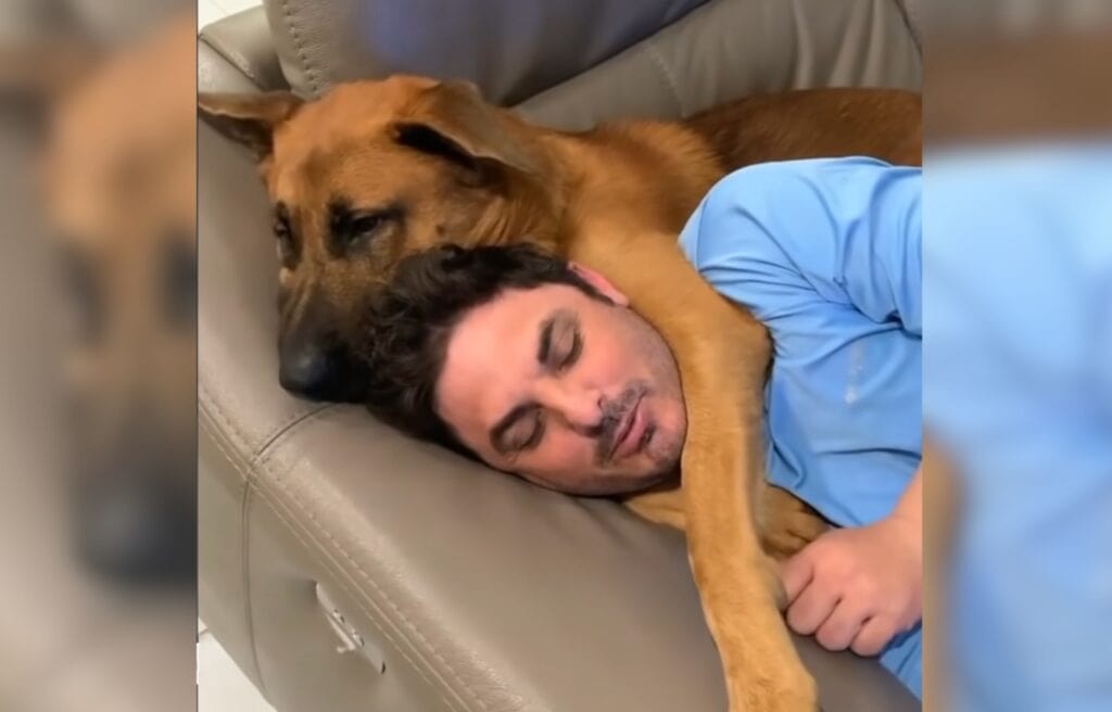 Rusty hugging his dad to sleep